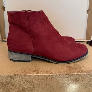 Gently worn burgundy colored boots.
